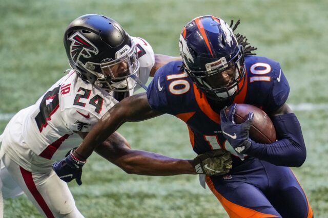 Denver Broncos wide receiver Jerry Jeudy (10) scores a touchdown past Atlanta Falcons cornerback A.J. Terrell (24) after making a catch during the second half at Mercedes-Benz Stadium.