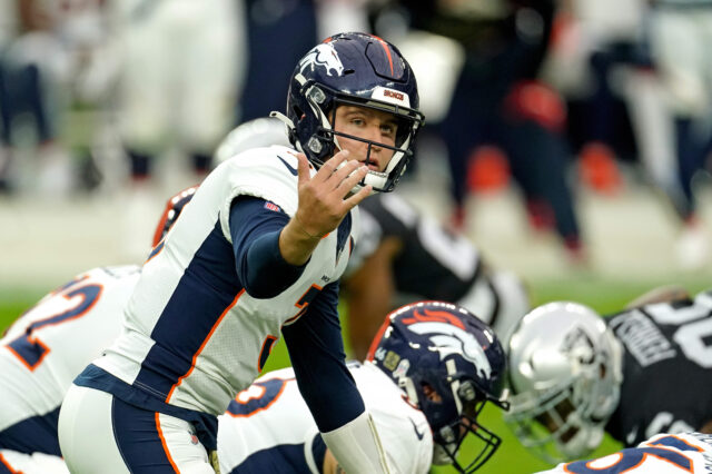 Denver Broncos quarterback Drew Lock (3) yells out from the line of scrimmage against the Las Vegas Raiders during the first half at Allegiant Stadium.