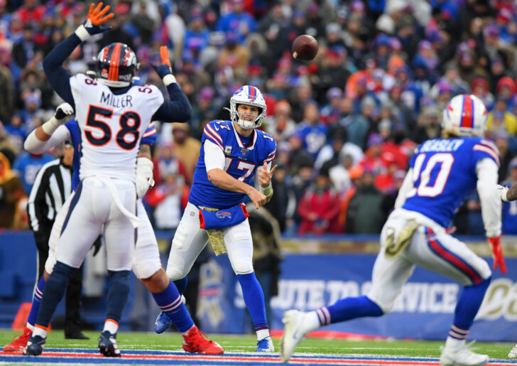 Buffalo Bills quarterback Josh Allen (17) passes the ball in the direction of wide receiver Cole Beasley (10) as Denver Broncos outside linebacker Von Miller (58) pressures during the fourth quarter at New Era Field.
