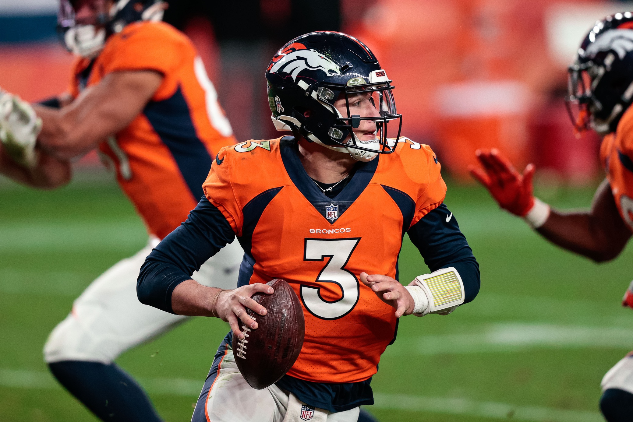 Denver Broncos quarterback Drew Lock (3) looks to pass in the fourth quarter against the Miami Dolphins at Empower Field at Mile High.