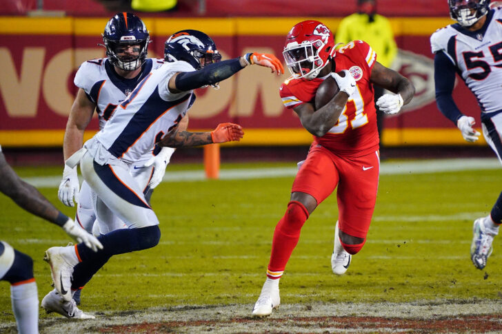 Kansas City Chiefs running back Darrel Williams (31) runs the ball while defended by Denver Broncos free safety Justin Simmons (31) during the second half at Arrowhead Stadium.