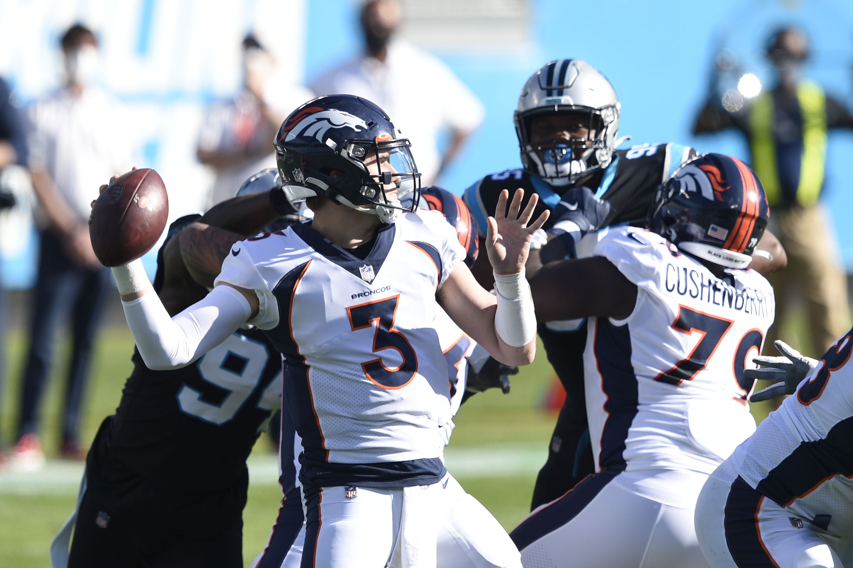 Denver Broncos quarterback Drew Lock (3) looks to pass the first quarter at Bank of America Stadium.