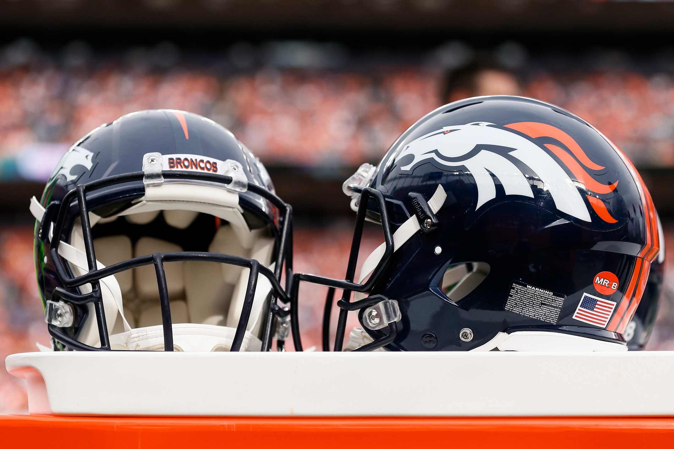 A general view of Denver Broncos helmets on the sidelines in the third quarter against the Chicago Bears at Empower Field at Mile High.