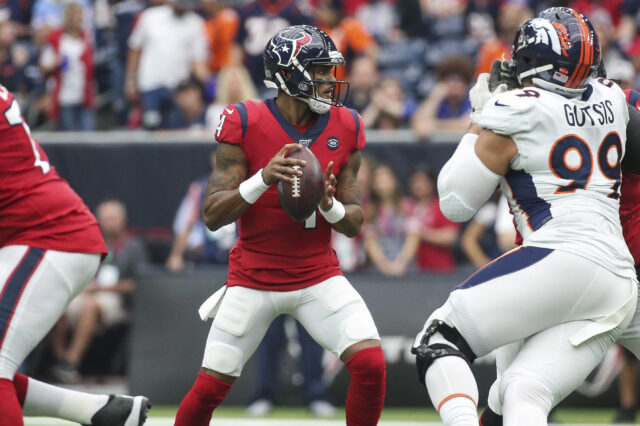 Houston Texans quarterback Deshaun Watson (4) looks for an open receiver during the first quarter against the Denver Broncos at NRG Stadium.