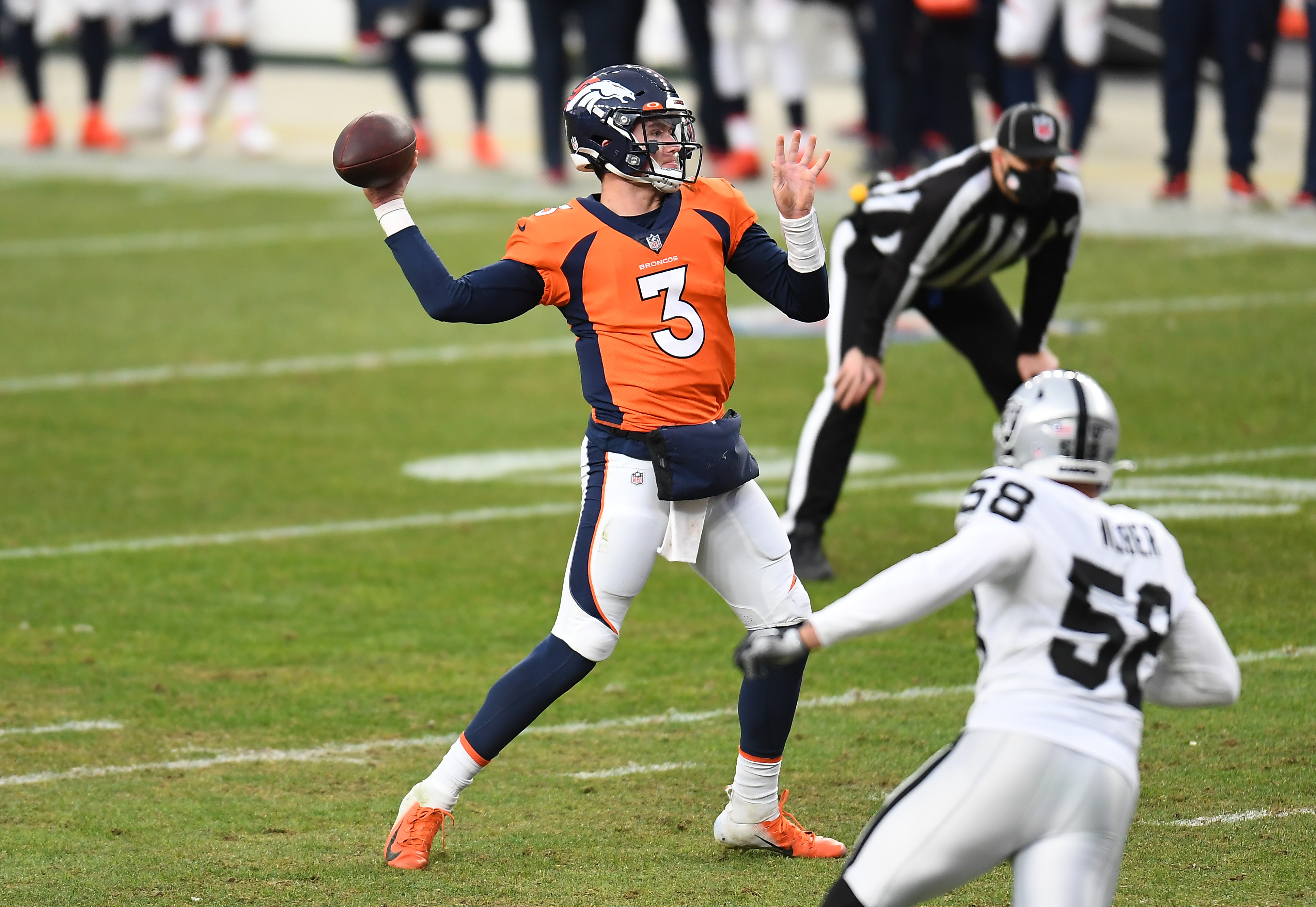 Denver Broncos quarterback Drew Lock (3) passes the ball in the first quarter against the Las Vegas Raiders at Empower Field at Mile High.