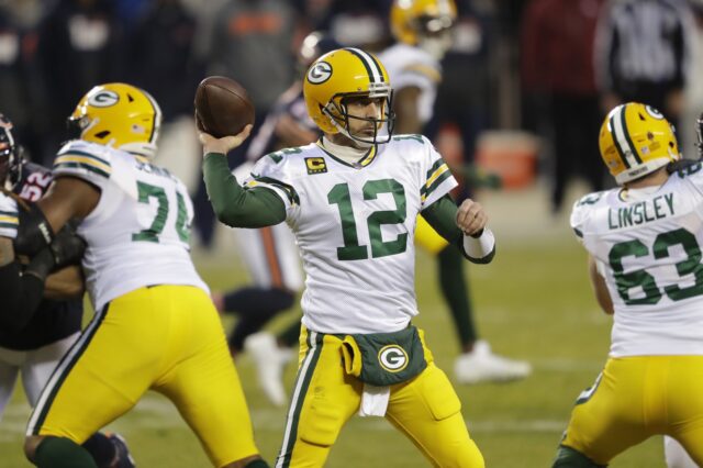 Green Bay Packers quarterback Aaron Rodgers (12) passes against the Chicago Bears during their football game Sunday, January 3, 2021, at Soldier Field in Chicago, Ill.