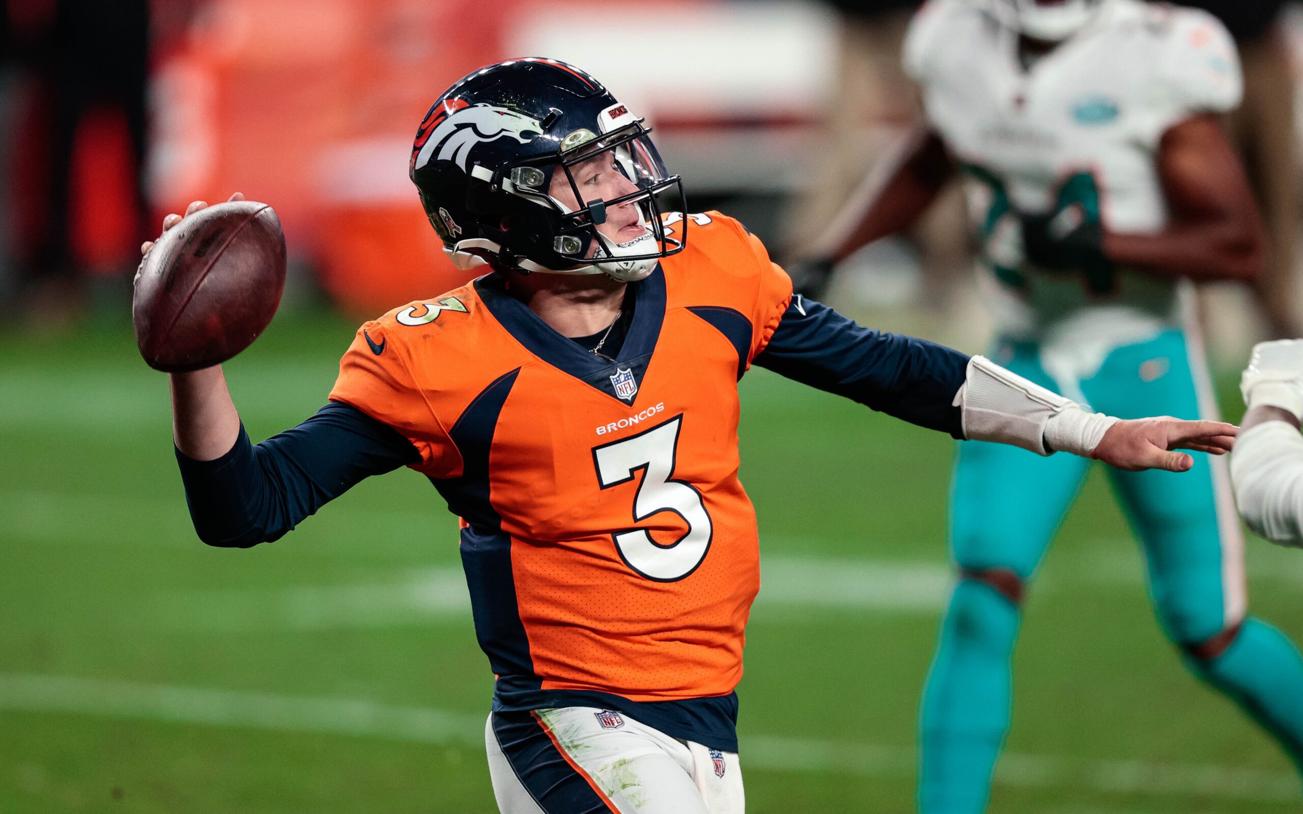 Denver Broncos quarterback Drew Lock scrambles against the New England  Patriots in the second half of an NFL football game, Sunday, Oct. 18, 2020,  in Foxborough, Mass. (AP Photo/Steven Senne Stock Photo 