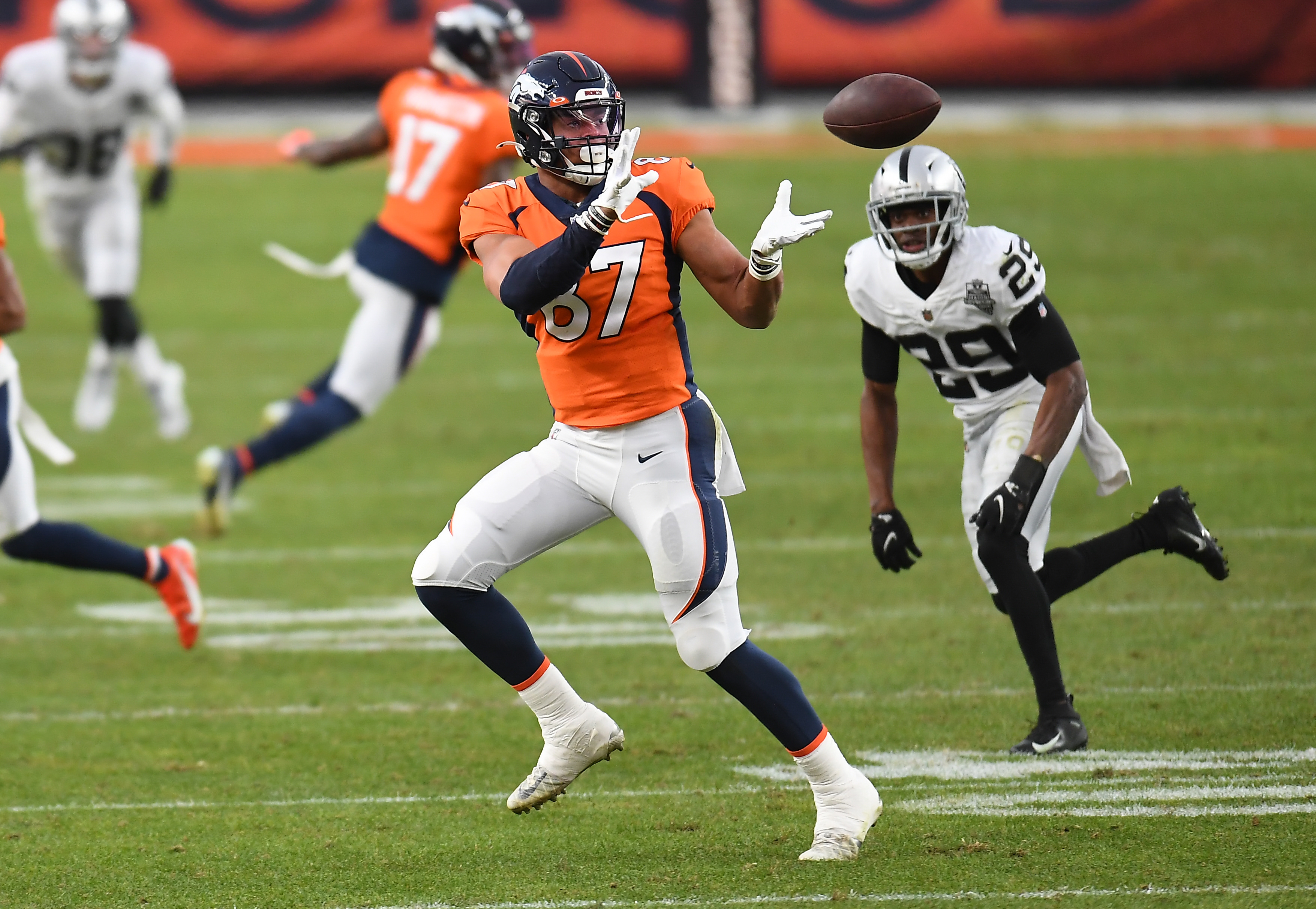 Denver Broncos tight end Noah Fant (87) makes a catch against the Las Vegas Raiders during the second quarter at Empower Field at Mile High.
