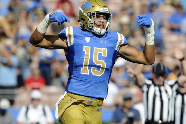 UCLA Bruins linebacker Jaelan Phillips (15) reacts after a defensive play against the Cincinnati Bearcats during the first half at the Rose Bowl.