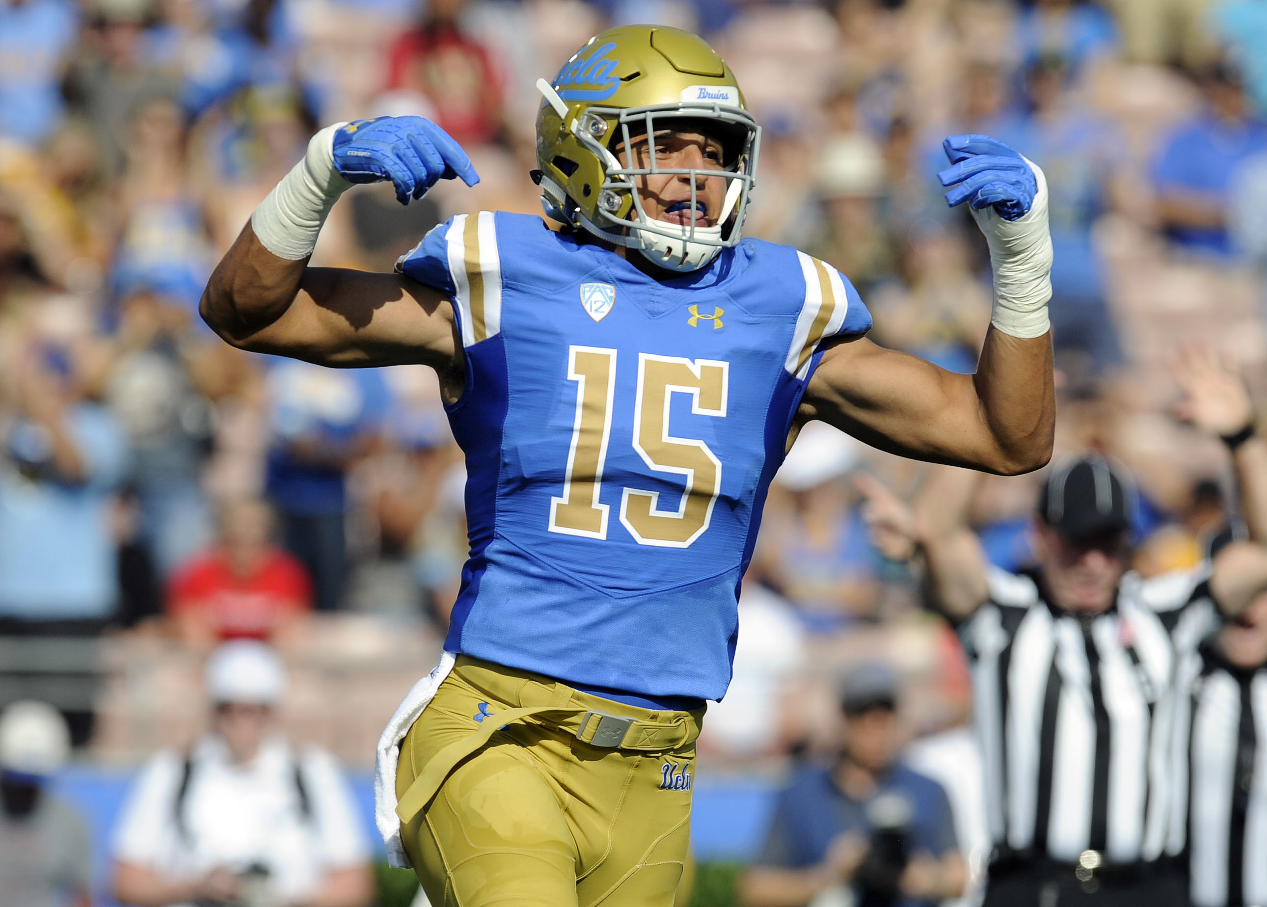 UCLA Bruins linebacker Jaelan Phillips (15) reacts after a defensive play against the Cincinnati Bearcats during the first half at the Rose Bowl.