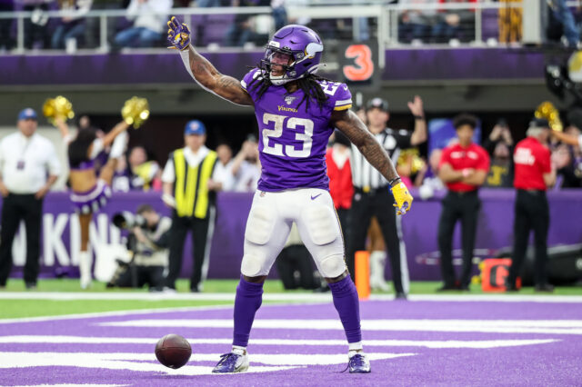 Minnesota Vikings running back Mike Boone (23) celebrates a touchdown during the fourth quarter against the Chicago Bears at U.S. Bank Stadium.