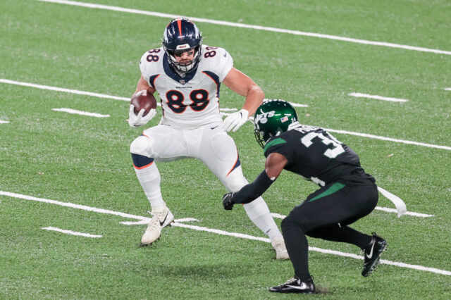 Denver Broncos tight end Nick Vannett (88) gains yards after catch as New York Jets cornerback Brian Poole (34) defends during the first half at MetLife Stadium.