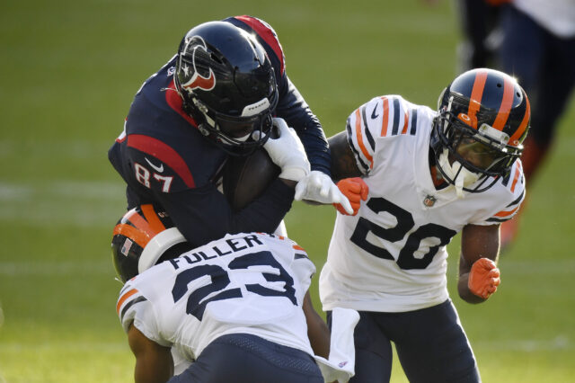 Houston Texans tight end Darren Fells (87) is tackled in the second half against Chicago Bears cornerback Duke Shelley (20) and Chicago Bears cornerback Kyle Fuller (23) at Soldier Field.