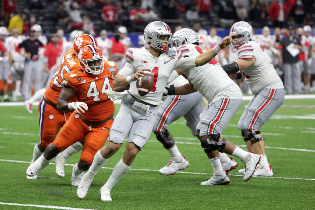 Ohio State Buckeyes quarterback Justin Fields (1) directs a receiver during the second half against the Clemson Tigers at Mercedes-Benz Superdome.