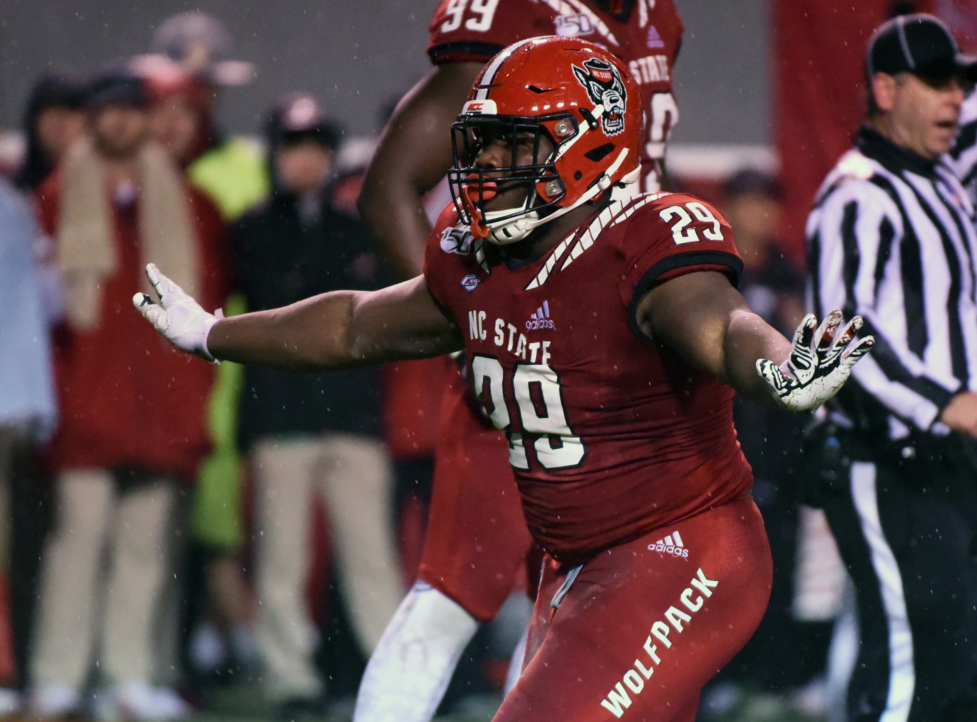 North Carolina State Wolfpack defensive tackle Alim McNeill (29) celebrates after a sack against the North Carolina Tar Heels during the first half at Carter-Finley Stadium.