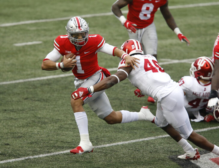 Ohio State Buckeyes quarterback Justin Fields (1) runs while defended by Indiana Hoosiers linebacker Aaron Casey (46) during the second quarter at Ohio Stadium.