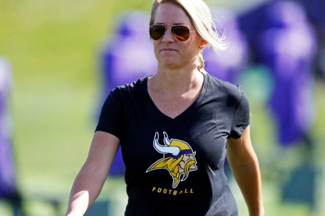Kelly Kleine, the the Minnesota Vikings coordinator of college scouting, poses during NFL football practice in Eden Prairie, Minn. Kleine started with the Vikings as a public relations intern but has spent the last five years in the scouting department and has gradually added more responsibilities to her plate. Now she also works with special teams to evaluate players in addition to organizing the scouting department