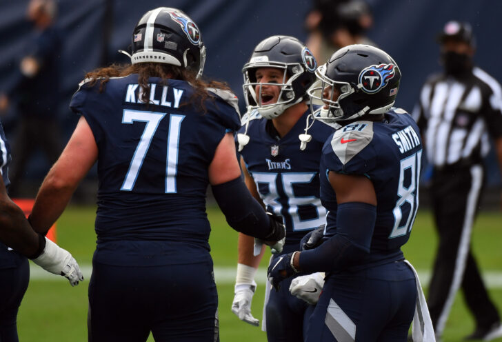 Oct 18, 2020; Nashville, Tennessee, USA; Tennessee Titans tight end Anthony Firkser (86) celebrates with offensive tackle Dennis Kelly (71) and tight end Jonnu Smith (81) after catching a touchdown pass against the Houston Texans during the first half at Nissan Stadium.