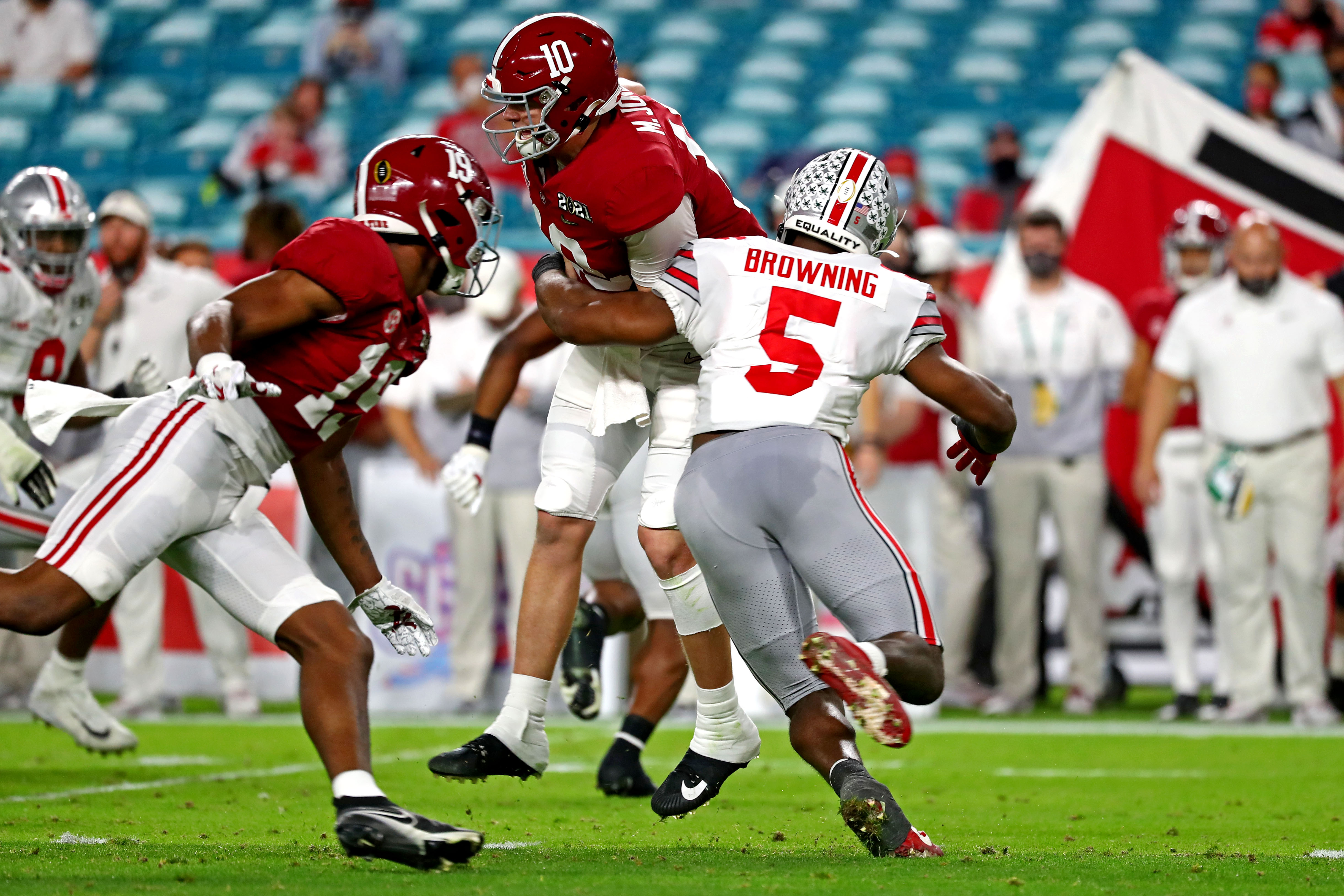 Ohio State Buckeyes linebacker Baron Browning (5) forces Alabama Crimson Tide quarterback Mac Jones (10) to fumble during the second quarter in the 2021 College Football Playoff National Championship Game.