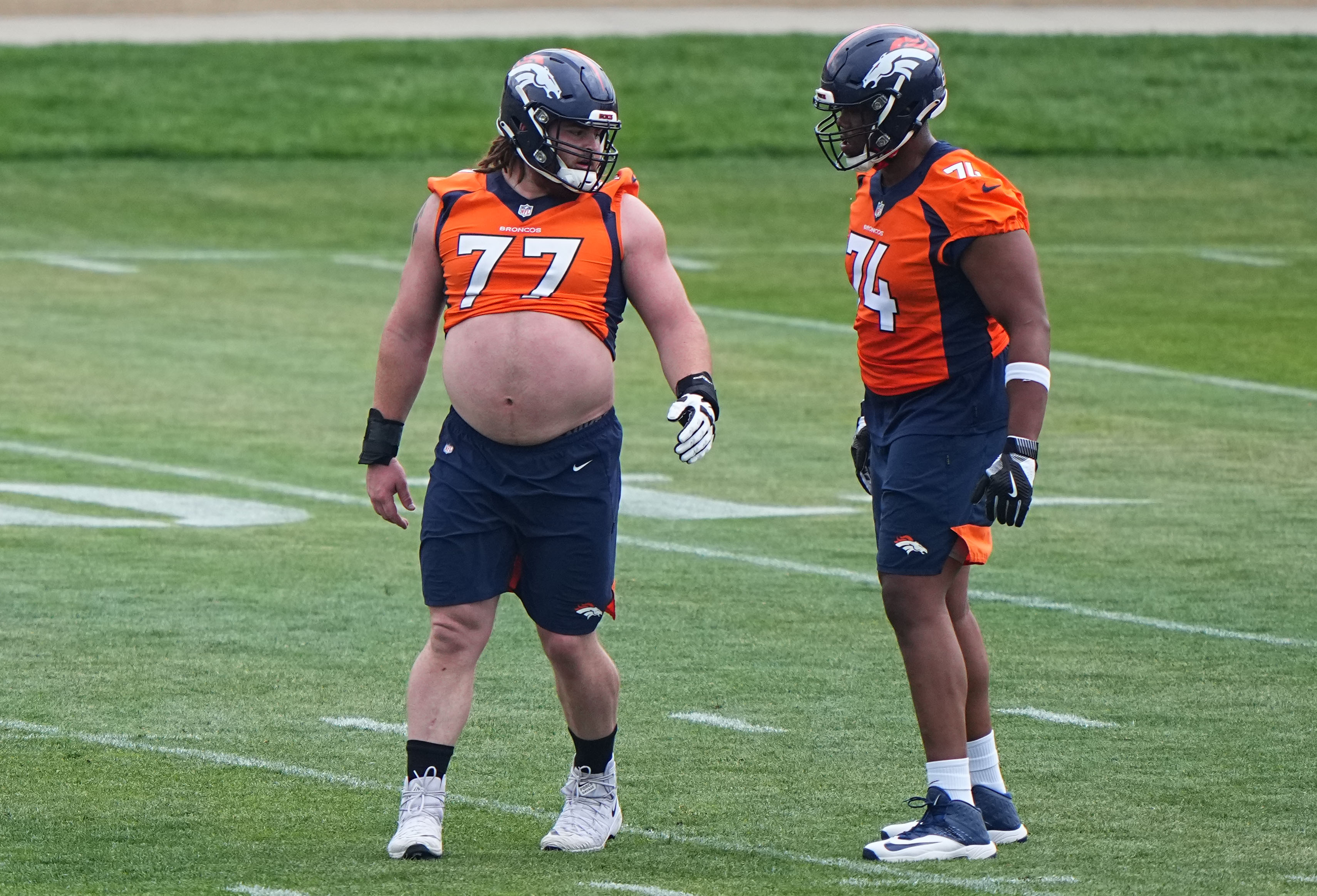 Denver Broncos guard Quinn Meinerz (77) and tackle Ryan Pope (74) during rookie minicamp at the UCHealth Training Center.