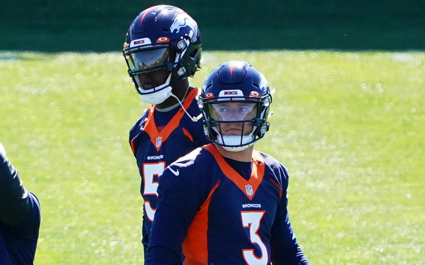 Teddy Bridgewater looks over Drew Lock's shoulder on Day 1 of OTAs in Denver. Credit: Ron Chenoy, USA TODAY Sports.