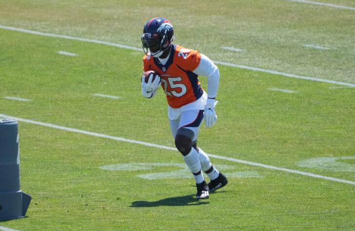 Denver Broncos running back Melvin Gordon (25) runs with the ball during an offseason workout at the UCHealth Training Center.