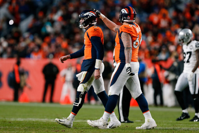 Denver Broncos quarterback Drew Lock (3) and offensive guard Dalton Risner (66) in the fourth quarter against the Oakland Raiders at Empower Field at Mile High.
