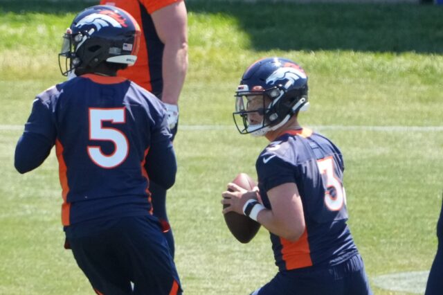 Drew Lock and Teddy Bridgewater in Broncos practices in June. Credit: Ron Chenoy, USA TODAY Sports.