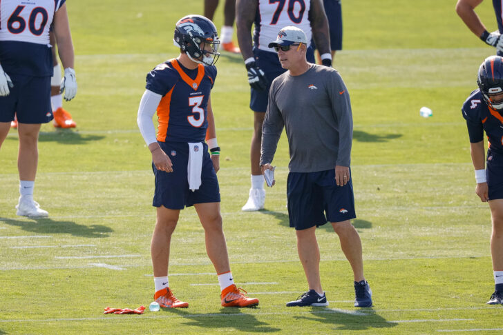 Denver Broncos quarterback Drew Lock (3) talks with offensive coordinator Pat Shurmur during training camp at UCHealth Training Center.