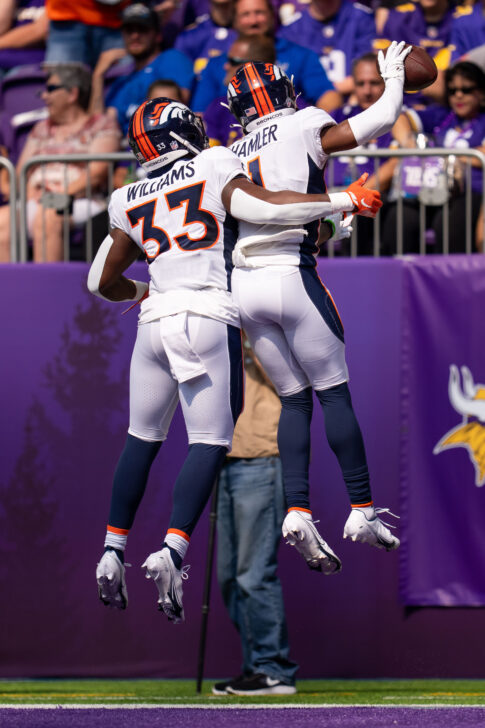 Denver Broncos wide receiver K.J. Hamler (1) celebrates his touchdown with running back Javonte Williams (33) against the Minnesota Vikings in the first quarter at U.S. Bank Stadium.