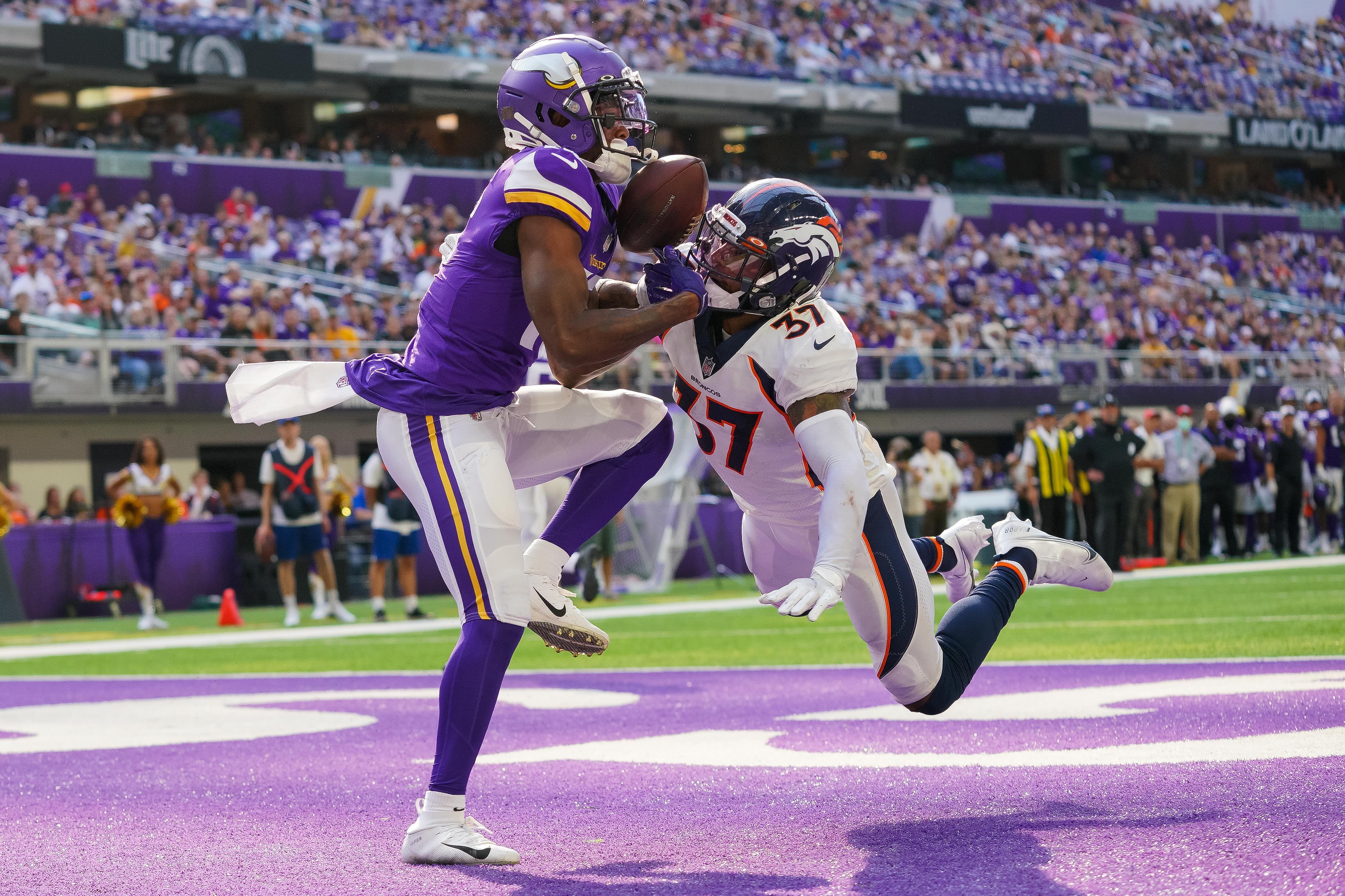 Minnesota Vikings wide receiver Whop Philyor (16) attempts to catch a pass against the Denver Broncos defensive back P.J. Locke (37) in the third quarter at U.S. Bank Stadium.