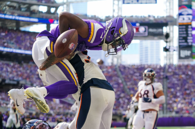 Denver Broncos safety Caden Sterns (30) breaks up a pass to Minnesota Vikings wide receiver Whop Philyor (16) in the third quarter at U.S. Bank Stadium.