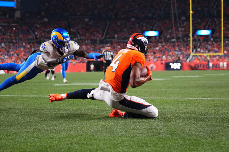 Denver Broncos wide receiver Courtland Sutton (14) pulls in a touchdown against Los Angeles Rams cornerback Robert Rochell (31) in the second quarter of a preseason game at Empower Field at Mile High.