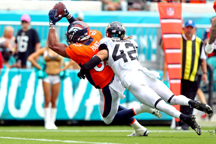 Denver Broncos tight end Noah Fant (87) scores a touchdown against Jacksonville Jaguars defensive tackle DaVon Hamilton (52) during the third quarter at TIAA Bank Field.