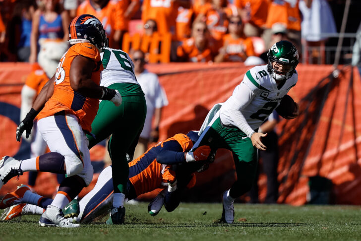New York Jets quarterback Zach Wilson (2) is sacked by Denver Broncos linebacker Malik Reed (59) in the second quarter at Empower Field at Mile High.