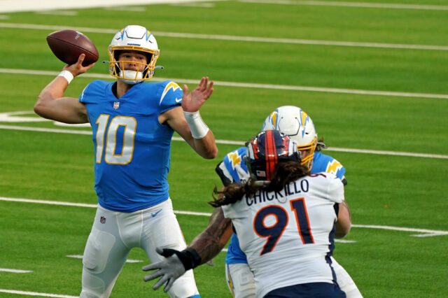 Los Angeles Chargers quarterback Justin Herbert (10) throws a pass against the Denver Broncos during the first half at SoFi Stadium.