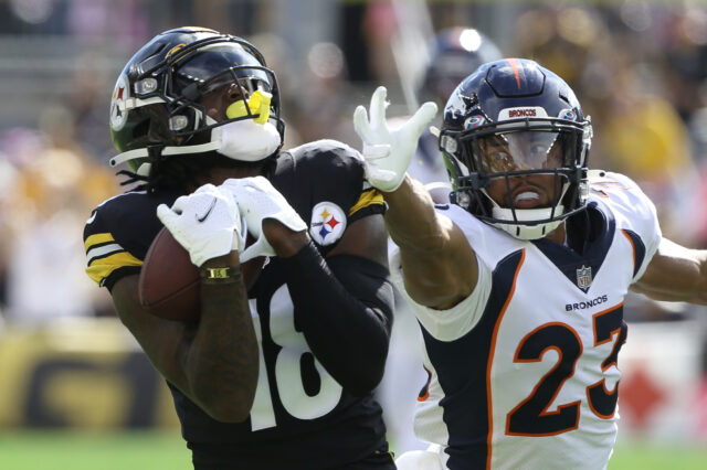 Pittsburgh Steelers wide receiver Diontae Johnson (18) catches a fifty yard touchdown pass behind Denver Broncos cornerback Kyle Fuller (23) during the first quarter at Heinz Field.