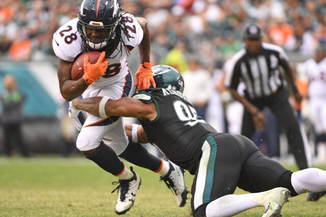 Denver Broncos running back Jamaal Charles (28) is tackled by Philadelphia Eagles outside linebacker Mychal Kendricks (95) during the fourth quarter at Lincoln Financial Field