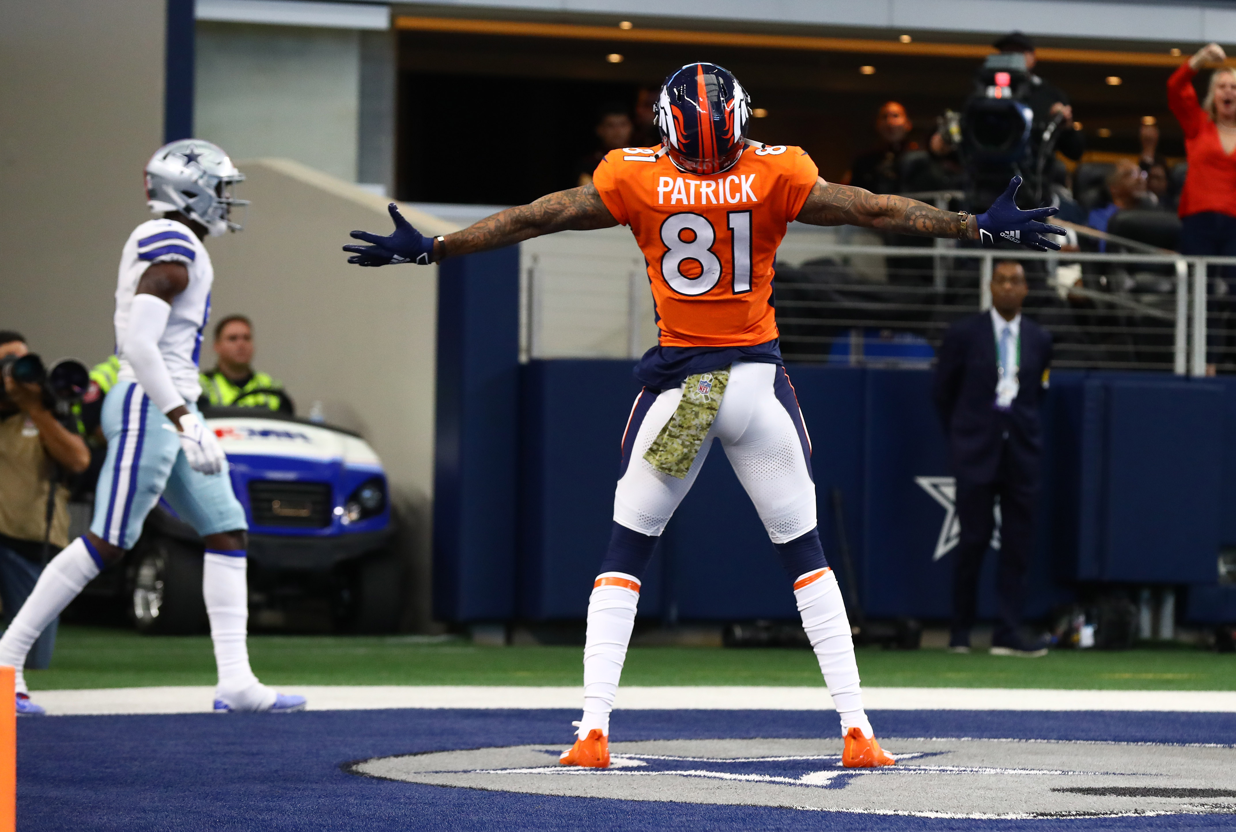 Denver Broncos receiver Tim Patrick (81) celebrates on the star in the end zone after scoring a touchdown in the second quarter against the Dallas Cowboys at AT&T Stadium.