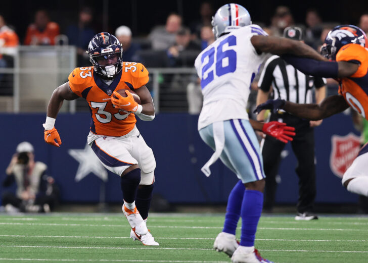 Denver Broncos running back Javonte Williams (33) runs with the ball in the second quarter against the Dallas Cowboys at AT&T Stadium.