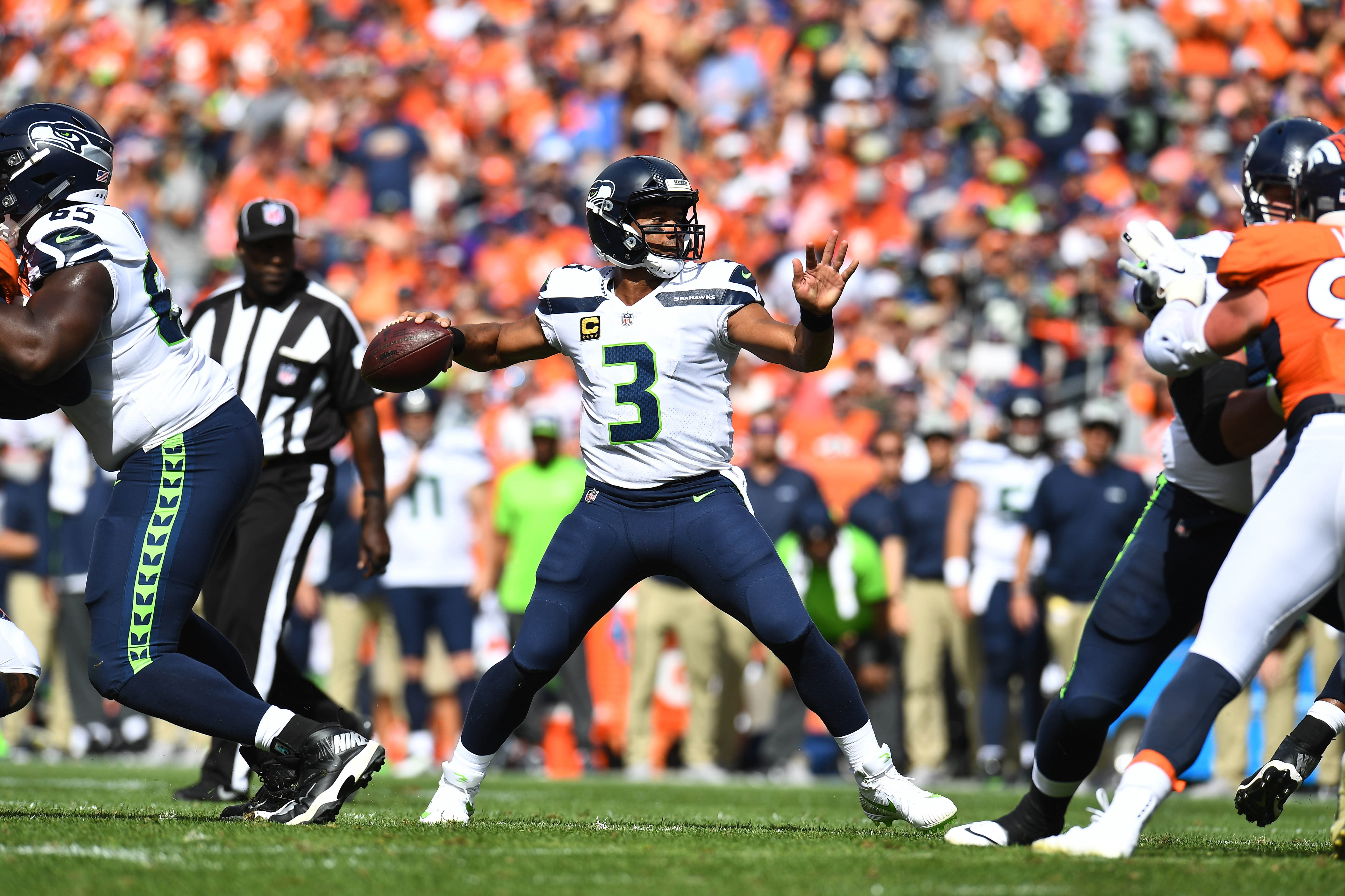 Seattle Seahawks quarterback Russell Wilson (3) attempts a pass in the second quarter against the Denver Broncos at Broncos Stadium at Mile High.