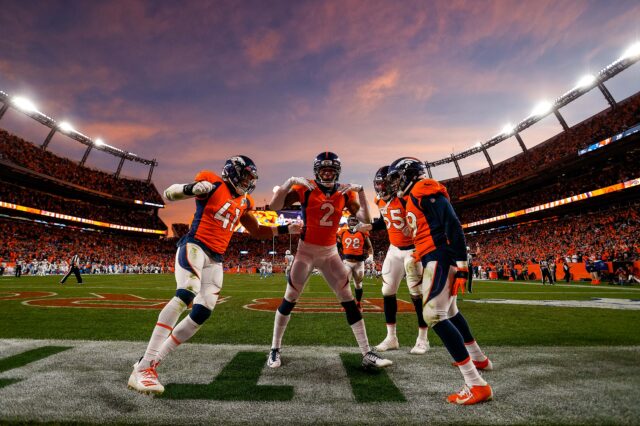 Nov 28, 2021; Denver, Colorado, USA; Denver Broncos cornerback Pat Surtain II (2) celebrates with linebacker Kenny Young (41) and linebacker Bradley Chubb (55) and linebacker Malik Reed (59) after scoring a touchdown on an interception in the fourth quarter against the Los Angeles Chargers at Empower Field at Mile High.