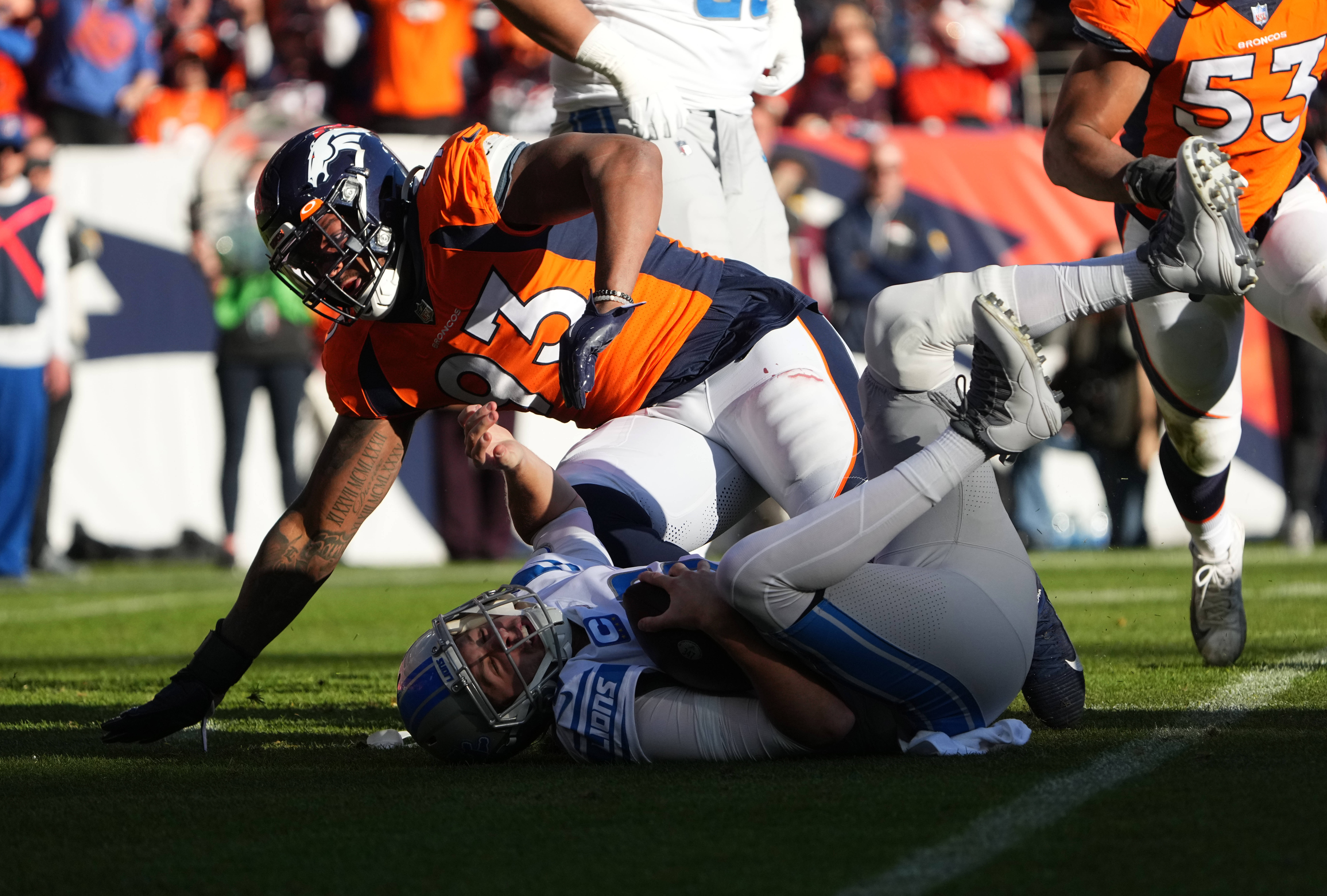 Denver Broncos defensive end Dre'Mont Jones (93) following a sack of Detroit Lions quarterback Jared Goff (16) in the first quarter at Empower Field at Mile High.