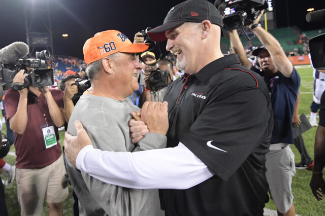 Denver Broncos head coach Vic Fangio and Atlanta Falcons head coach Dan Quinn shake hands after the Pro Football Hall of Fame Game at Tom Benson Hall of Fame Stadium. The Broncos defeated the Falcons 14-10.