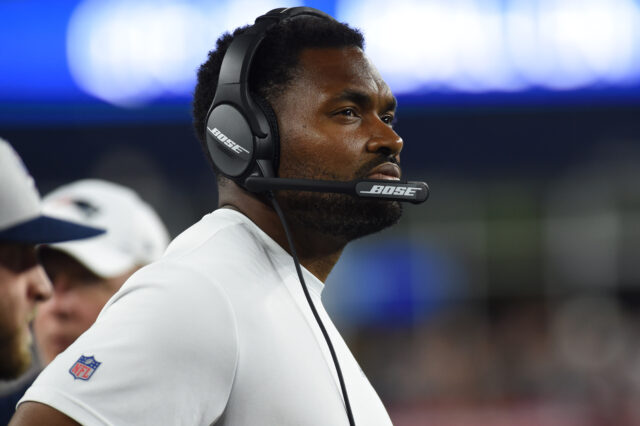 New England Patriots linebackers coach Jerod Mayo watches the action during the second half against the New York Giants at Gillette Stadium.