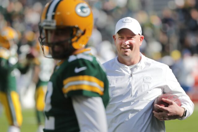 Green Bay Packers offensive coordinator Nathaniel Hackett talks with quarterback Aaron Rodgers (12) before their game against the Oakland Raiders Sunday, October 21, 2019 at Lambeau Field in Green Bay, Wis.
