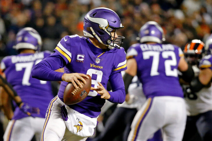 Minnesota Vikings quarterback Kirk Cousins (8) runs as he looks for a receiver against the Chicago Bears during the second quarter at Soldier Field.
