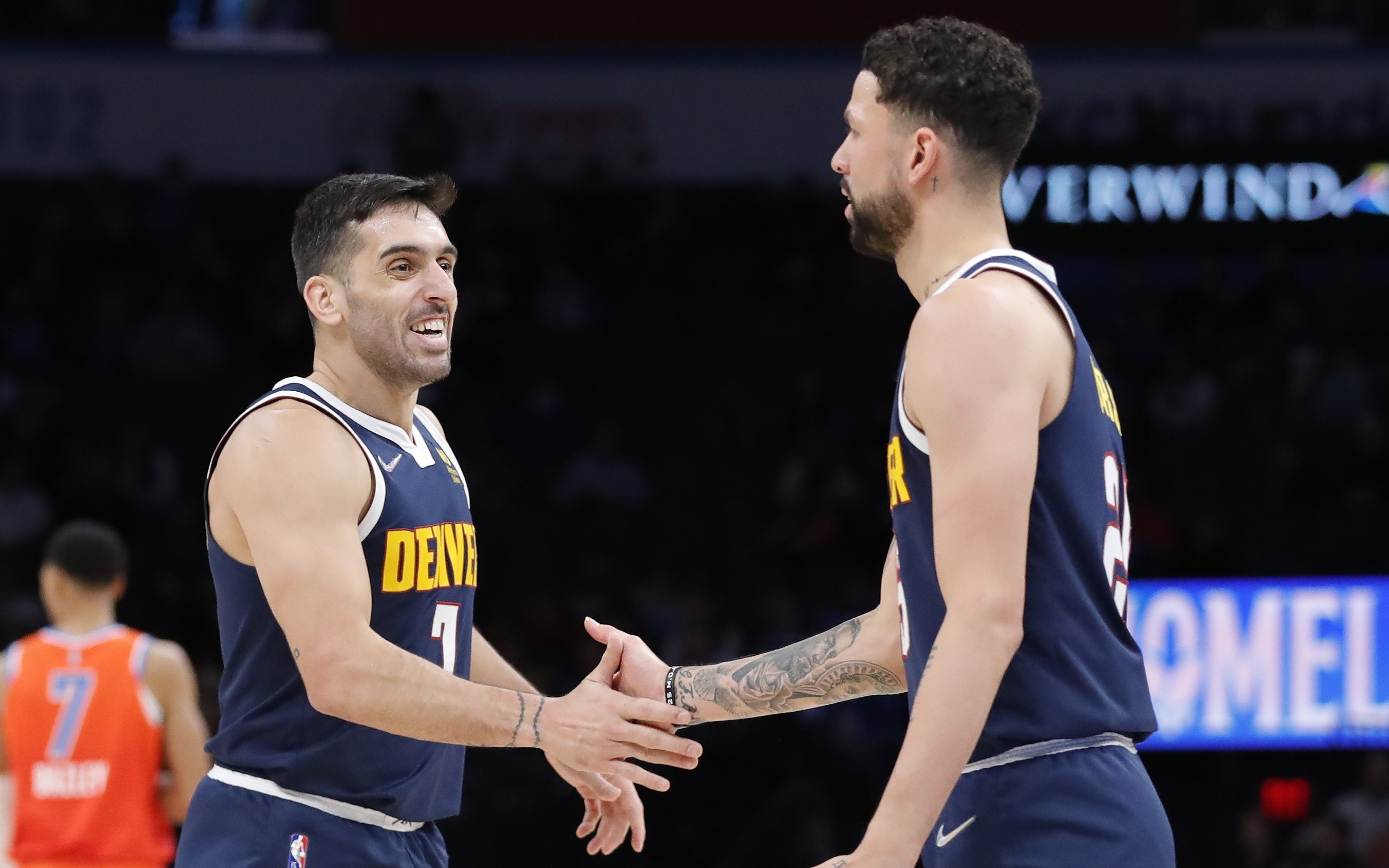 USATSI_17481093 Cropped Facundo Campazzo and Austin Rivers celebrate vs. OKC. Credit: Alonzo Adams, USA TODAY Sports.
