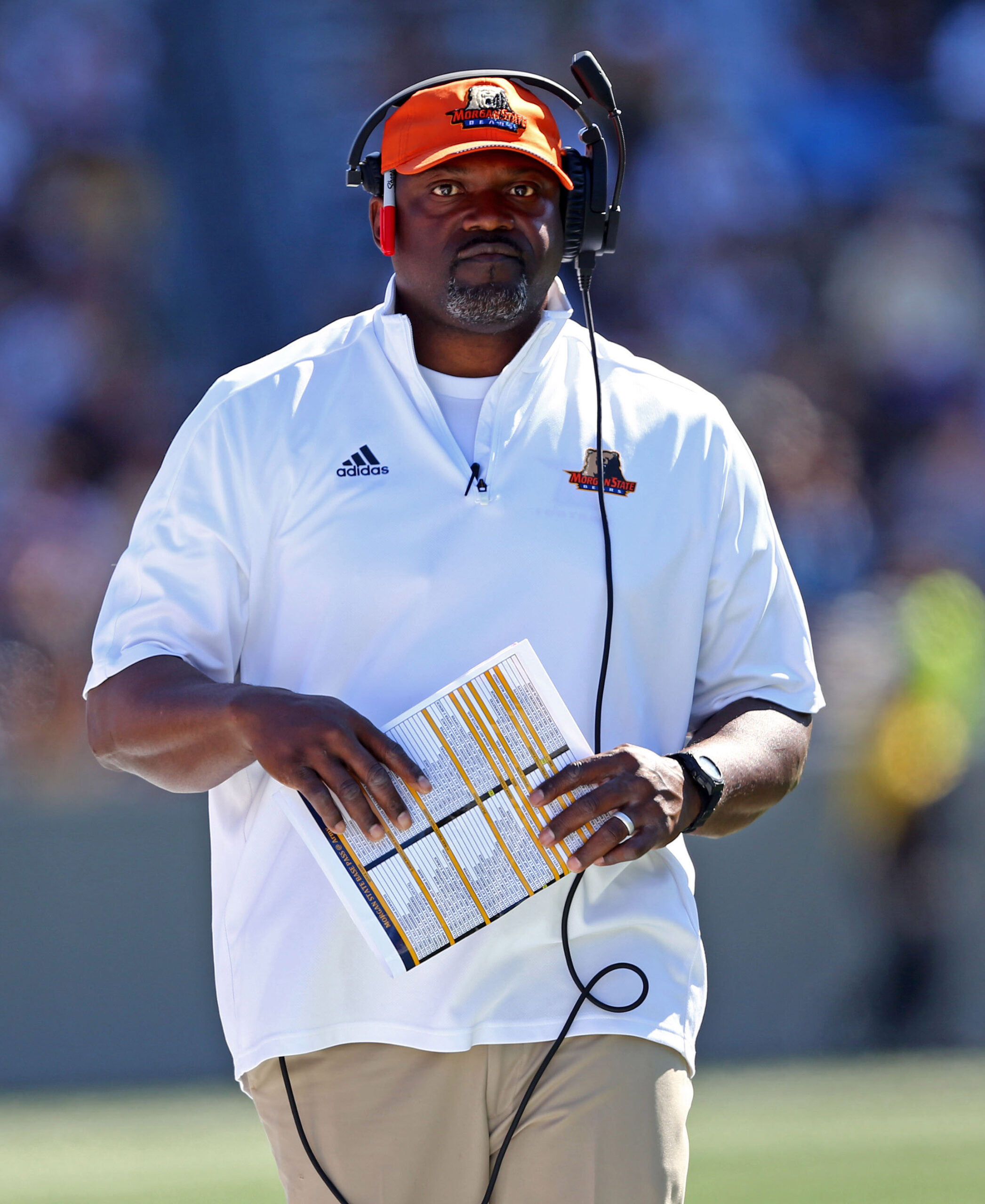 Denver Broncos running backs coach Curtis Modkins while taking