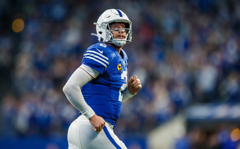 Indianapolis Colts quarterback Carson Wentz (2) runs off the field after connecting on a short touchdown pass with Colts wide receiver T.Y. Hilton (13) on Sunday, Nov. 28, 2021, against the Tampa Bay Buccaneers.